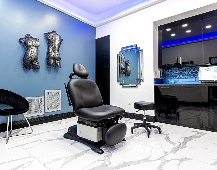 Modern aesthetic treatment room with stylish decor.