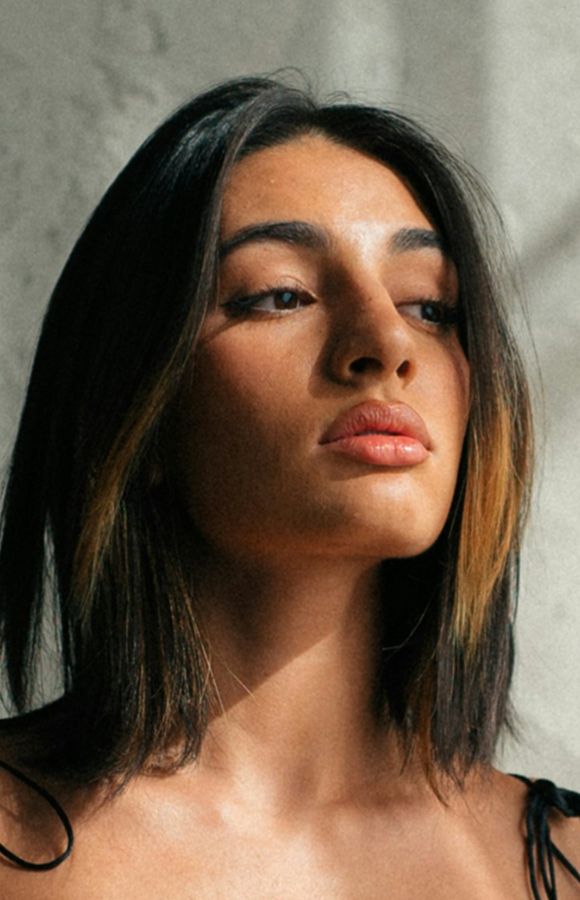 Portrait of a person with shoulder-length hair.