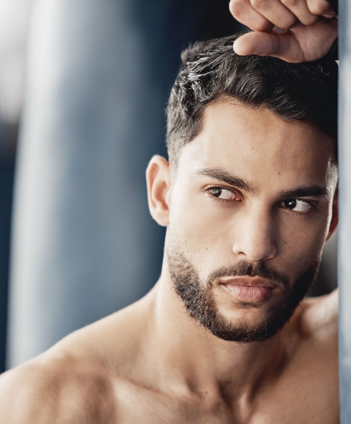 Close-up of a man with a thoughtful expression.