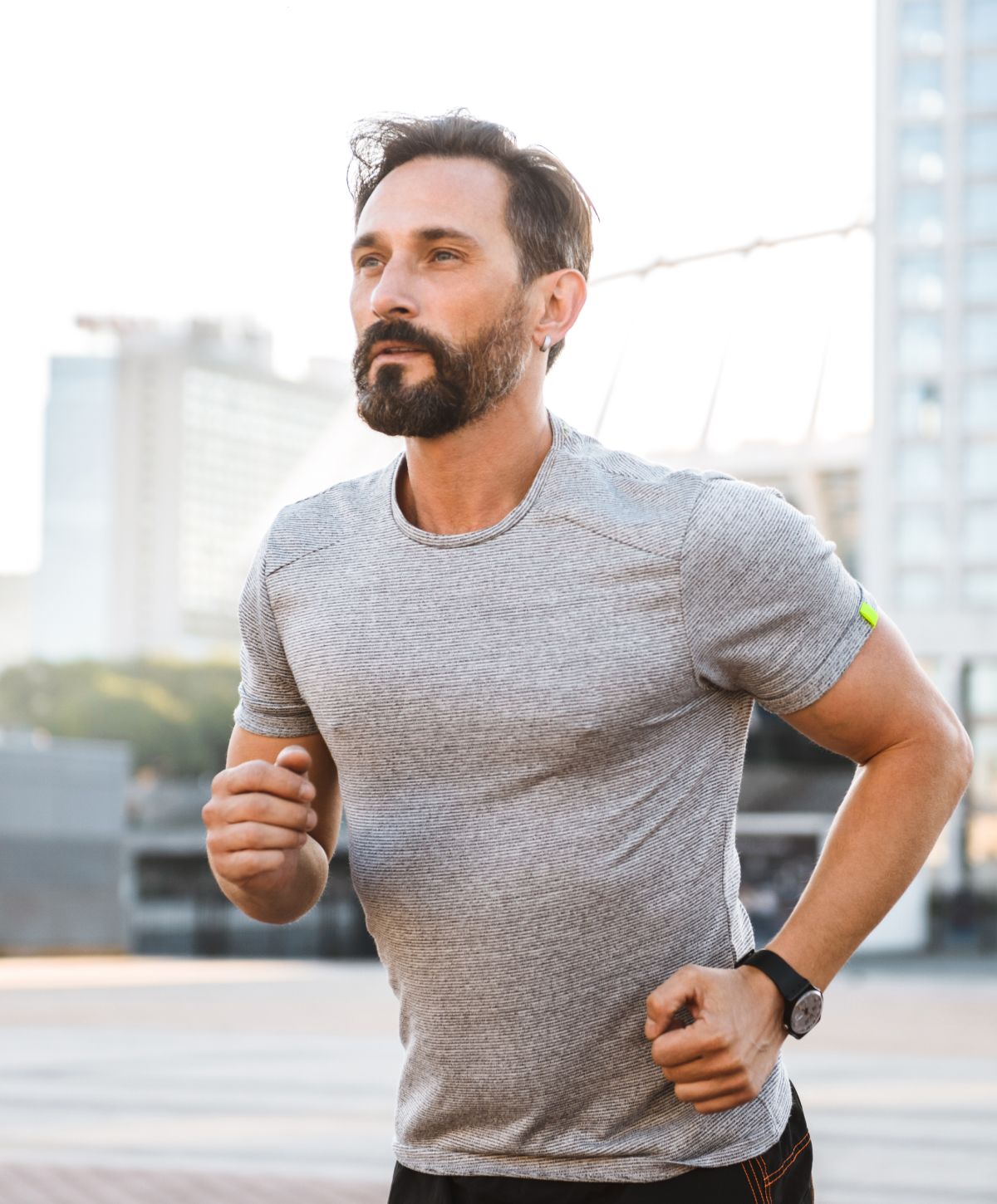 Runner training outdoors in athletic gear.