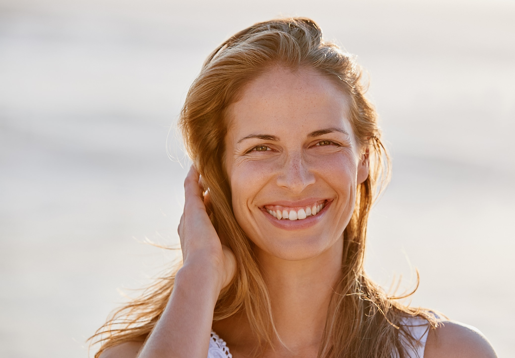 Lakewood Ranch Sofwave model enjoying sunny outdoor setting.