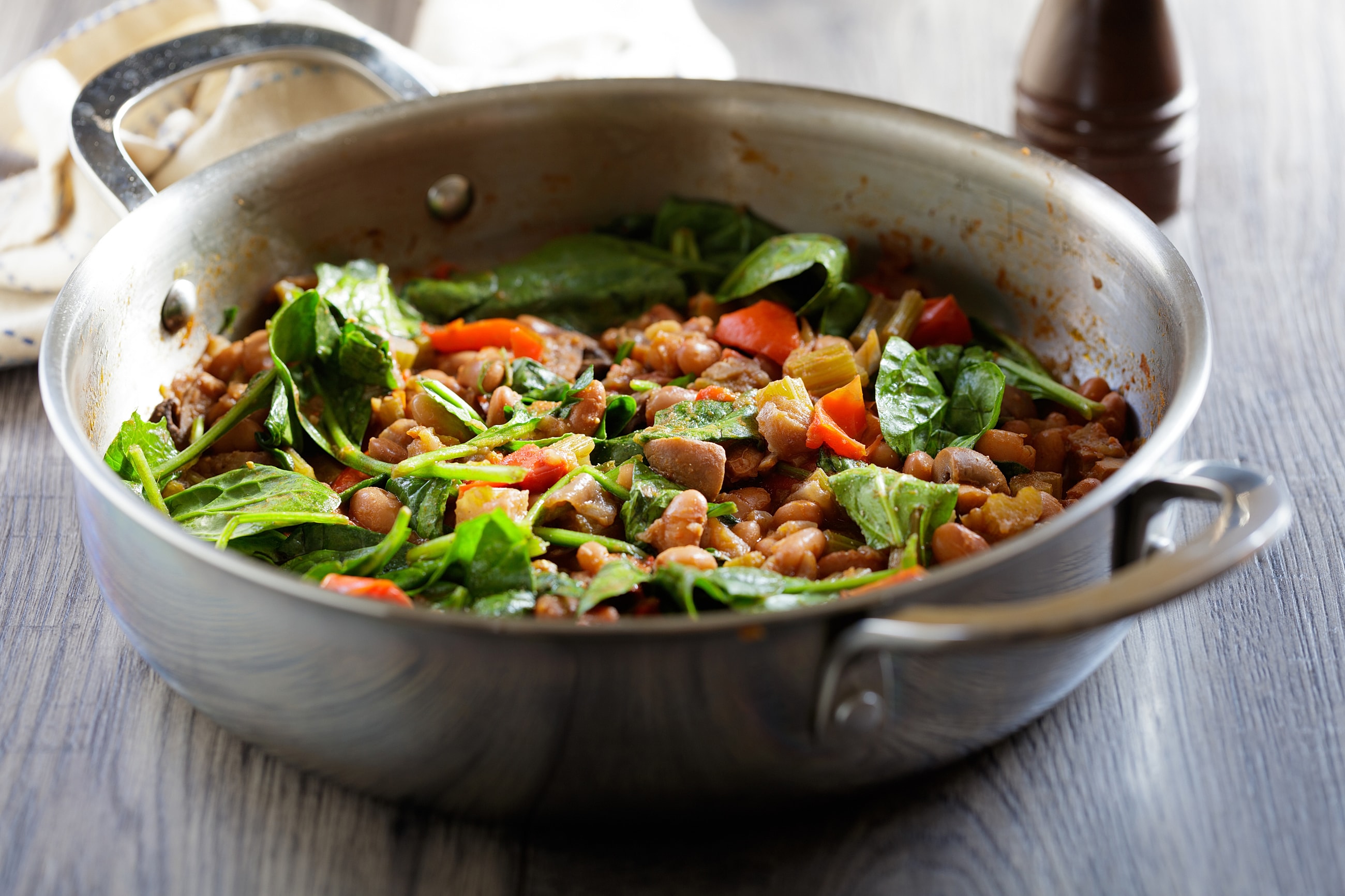 Vegetable and bean stir-fry in a pan.