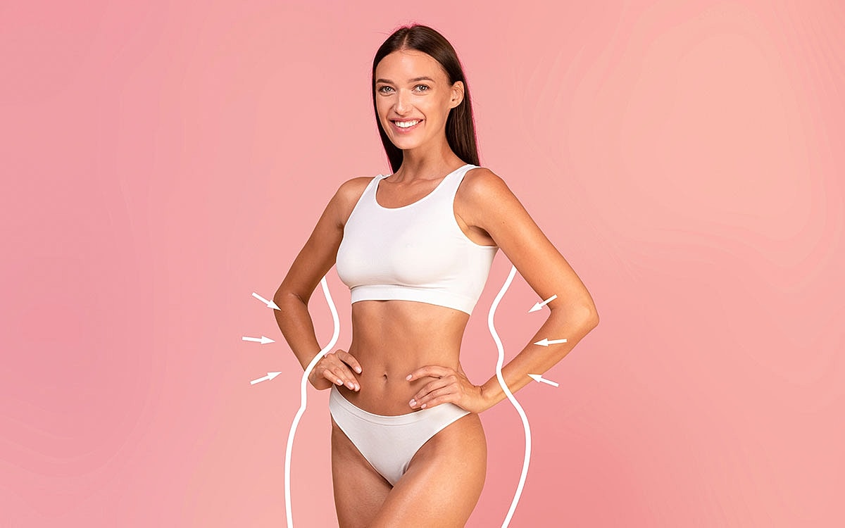 Woman in white outfit smiling against pink background.