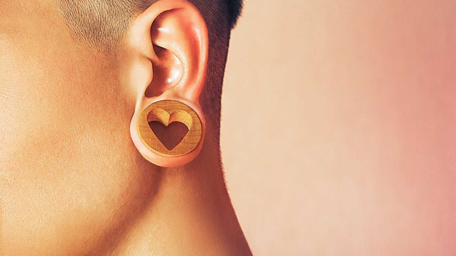 woman with large gauged heart earrings
