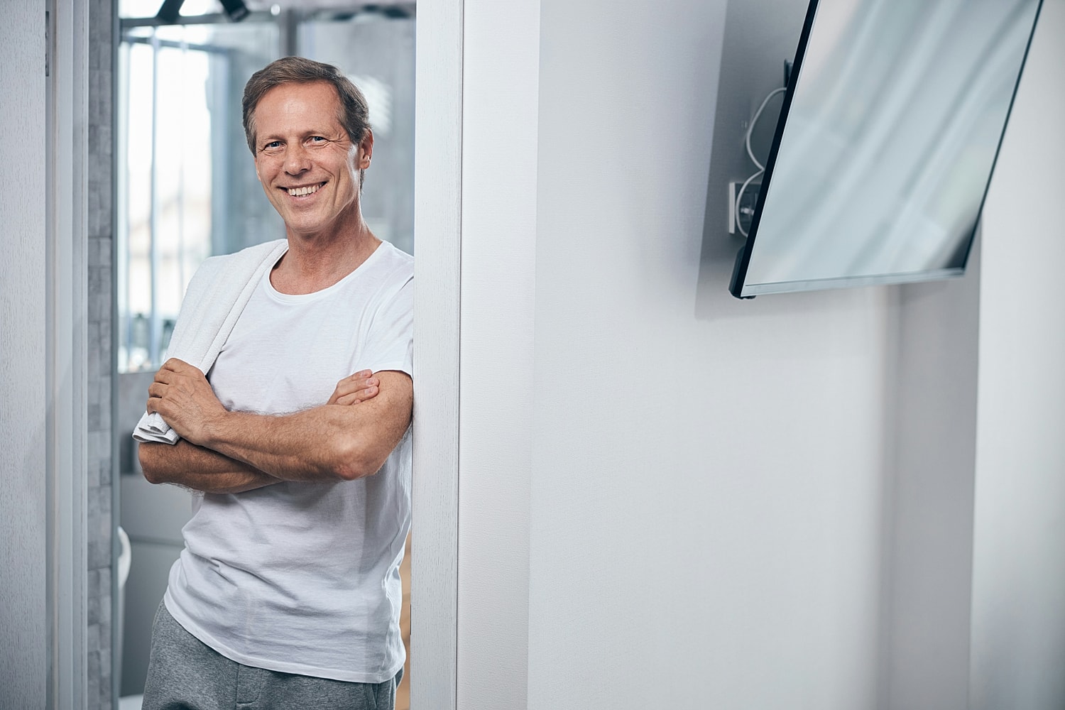 man smiling in modern home