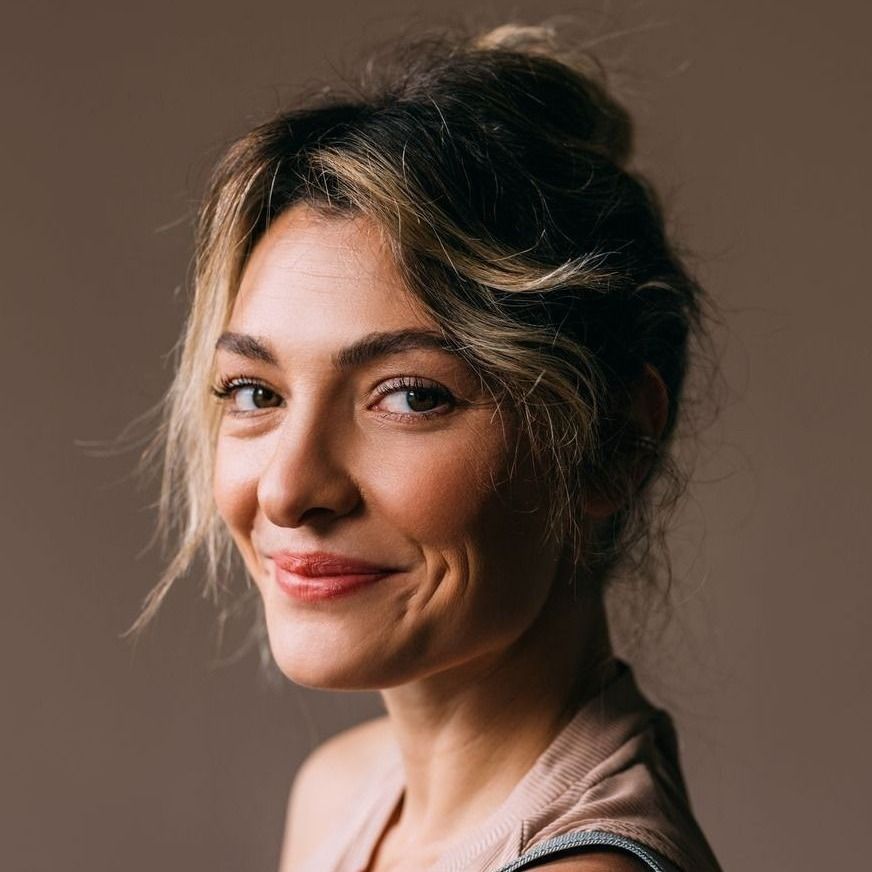 Farmington brow lift model with tousled hair and warm expression.